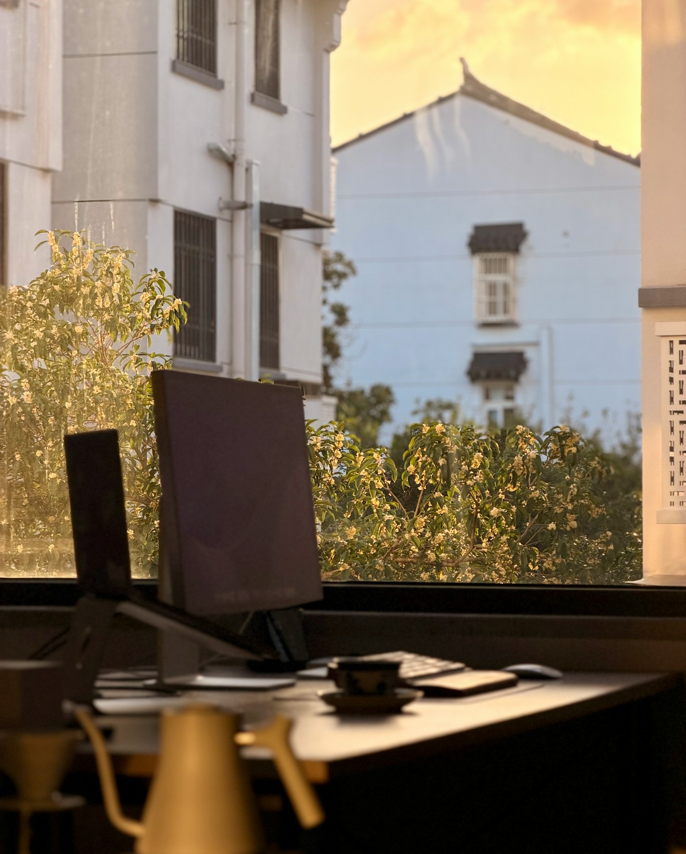 Laptop on a study desk by a window for AZ-104 certification exam preparation