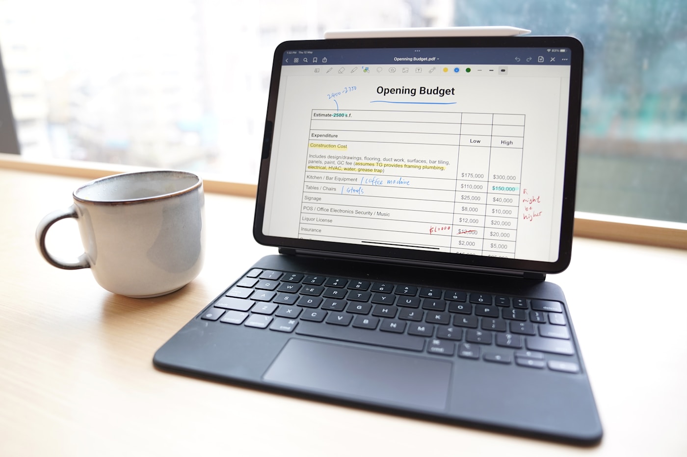 Tablet, coffee, and budget notes for comparing free and paid exam prep resources