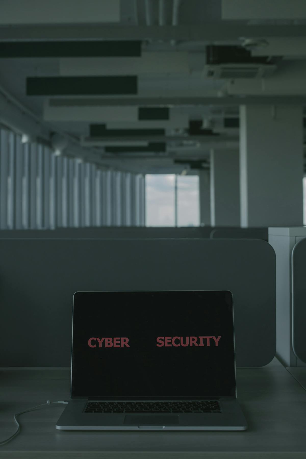 Laptop showing cyber security text, representing CompTIA Security+ SY0-701 exam preparation